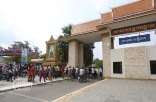 Villagers living near a new airport gather in front of the Kandal hall to submit a petition asking to be excluded from the development plan on April 24, 2023. (CamboJA/Pring Samrang)
