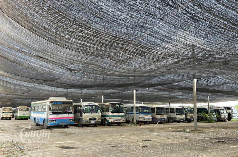 Buses parked outside the 7NG Factory waiting to transport garment workers on June 23, 2023. (Sovann Sreypich/CamboJA)