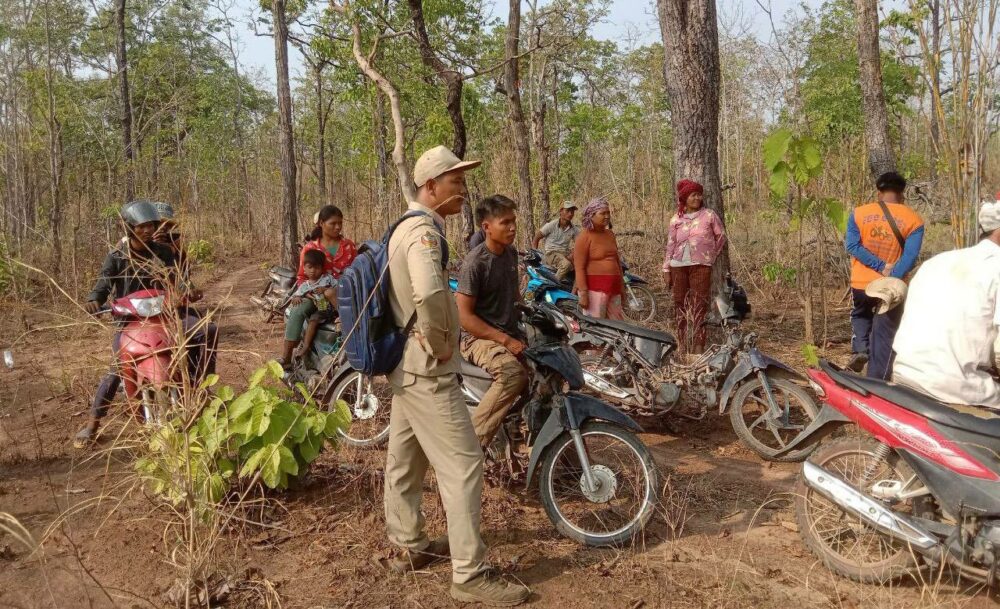 Indigenous Bunong villagers in Mondulkiri’s Roya Leu community confront environmental officials who they say were measuring their reserve forest lands on March 31. (Supplied)