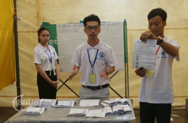 NEC officials count votes at a polling station Phnom Penh on June 5, 2022. (CamboJA/ Pring Samrang)