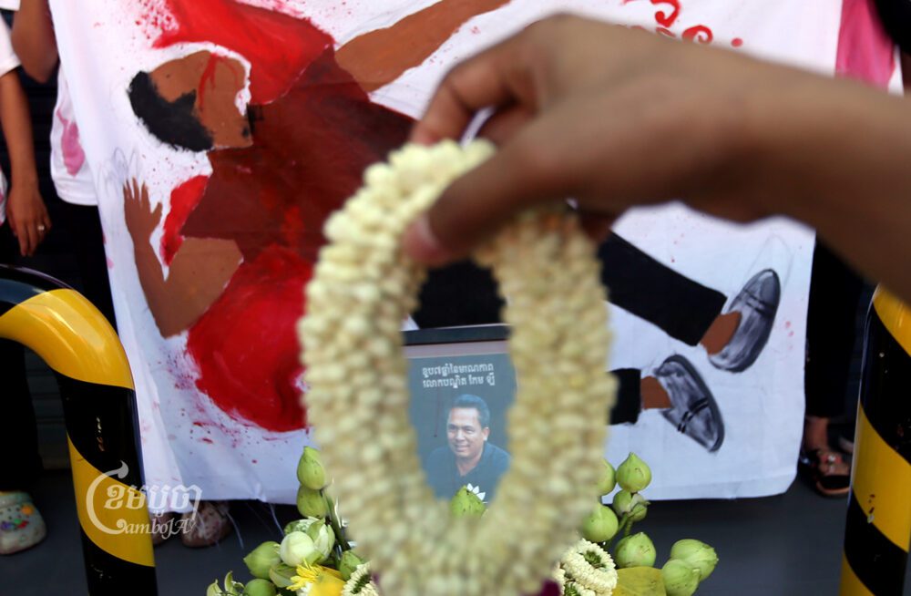 Civil society groups and youth activists paid their respects by laying down wreaths on the seventh anniversary of Kem Ley’s murder at the Caltex gas station where he was shot, on July 10, 2023. (CamboJA/Pring Samrang)