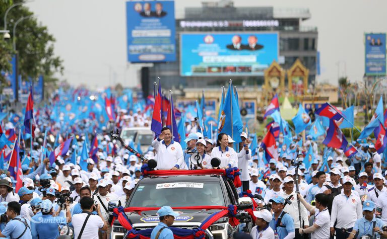Prime Minister Hun Sen's son Hun Manet and CPP members march in Phnom Penh during the last day of campaigning on July 21, 2023. (CamboJA/ Pring Samrang)