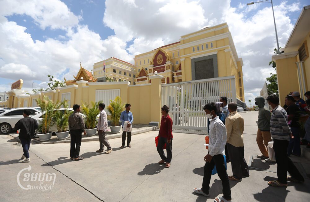 Villagers from Kandal, Kampong Chhnang and Kampong Cham provinces arrive at Phnom Penh Municipal Court to file complaints against tycoon Hy Kimhong, who allegedly defraud them in a real estate scheme, on August 9, 2023. (CamboJA/Pring Samrang)