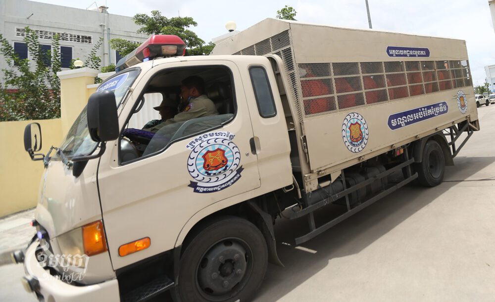 A police’s truck brings Candlelight Party Vice President Thach Setha and other prisoners from Phnom Penh Municipal Court to prison after hearings on September 6, 2023. (CamboJA/Pring Samrang)