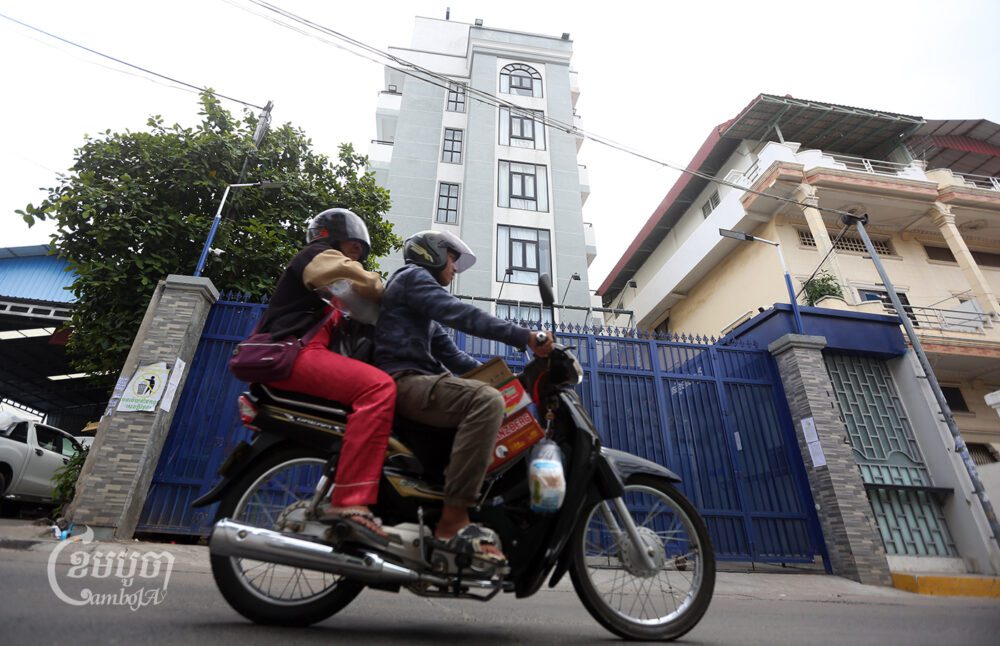 A motorist rides past the Metro RLV Polyclinic in Phnom Penh, which has been ordered shut, October 19, 2023. CamboJA/ Pring Samrang