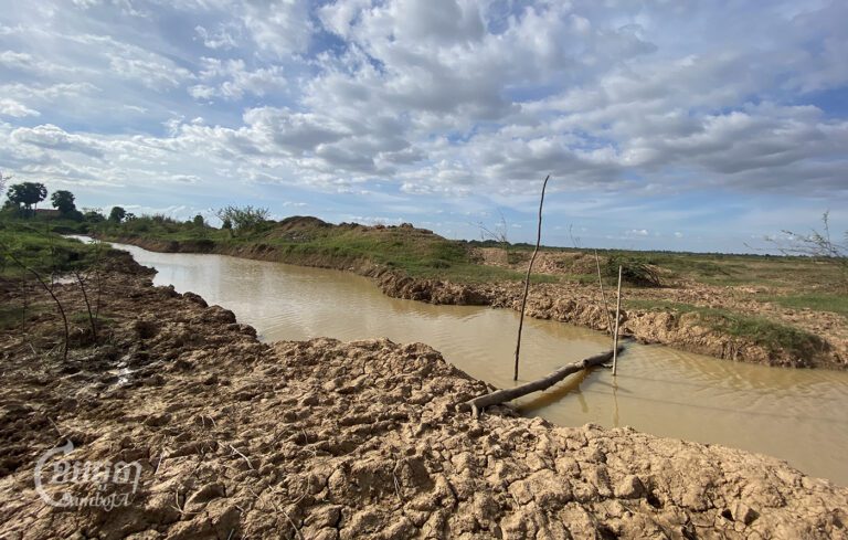 A two-meter wide canal, dug by the new airport company in 2021, cut off access for farmers to their farmland on December 06, 2023. (CamboJA / Phon Sothyroth)