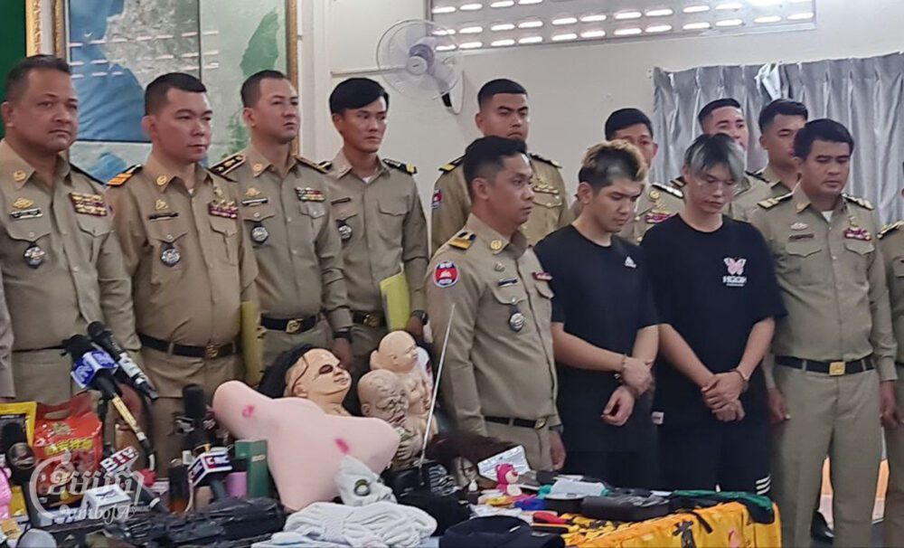 Preah Sihanouk provincial authorities hold a press conference to show the two suspects, Chen Neng Chuan and Lu Tsu Hsien, and items seized from their hotel, at provincial police headquarters on February 15, 2024. (CamboJA/Den Seymar)
