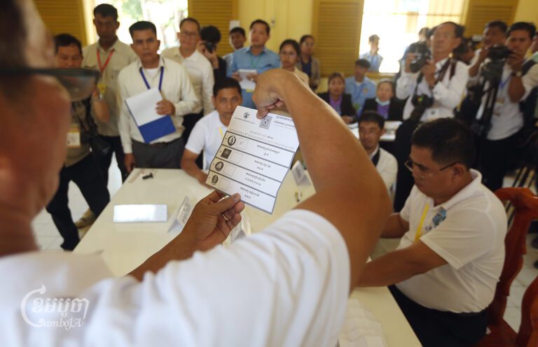 NEC officials count ballots in the Senate election at the Preah Sisowath High School polling station in Phnom Penh on February 25, 2024. (CamboJA/Pring Samrang)