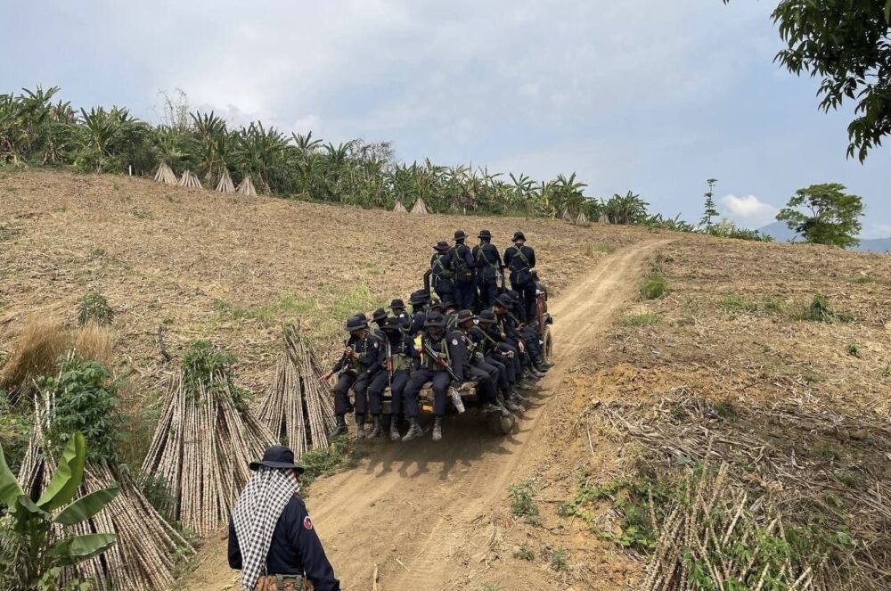 A group of gendarmes taking Koyun through a farmland during the natural resource crackdown in Pursat, on GRK News Facebook page on 19 March 2024.