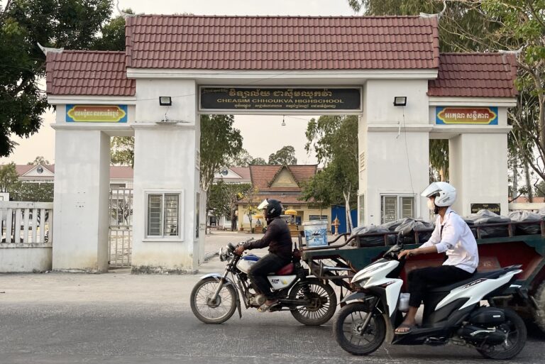 Motorists ride past Chea Sim Chhouk Va High School, on March 26, 2024. (CamboJA)