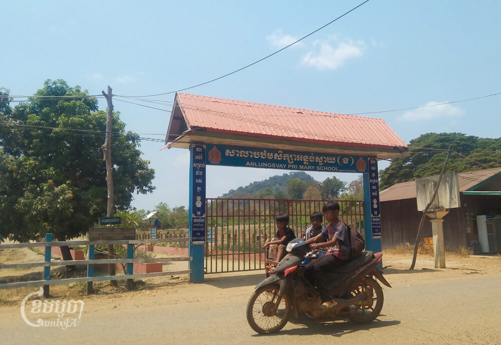 Students of Anlong Svay Primary School returning home by motorcycle in Preah Rumkel commune, Borey O'Svay Senchey district, Stung Treng province on March 22, 2024 (CamboJA/ Pou Soreachny)