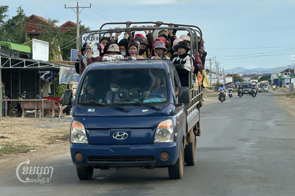 A truck transports garment workers after their shift at a factory in Kampong Speu province on May 21, 2024. (CamboJA/Pring Samrang)