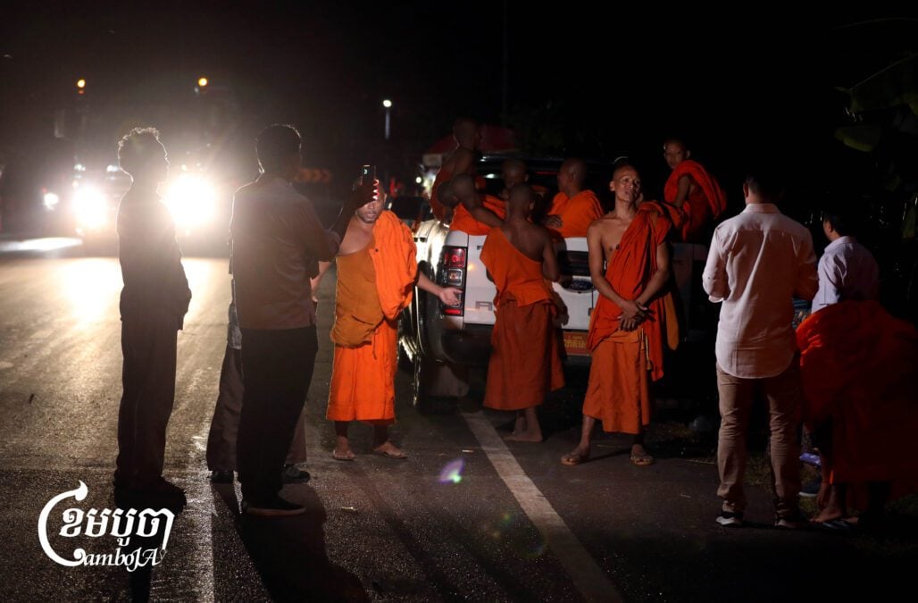 Monks travel overnight to Siem Reap province after fleeing bombing during clashes along the Cambodia-Thailand border near the Prasat Ta Moan temple on July 24, 2025. At least one layman was reported killed during the bombing. (CamboJA/Pring Samrang)