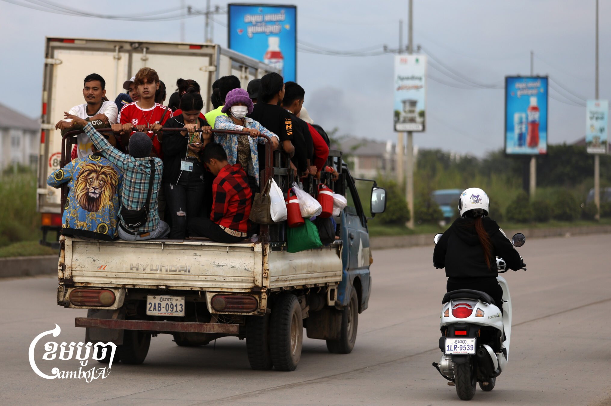 A truck transports garment workers to a factory on the outskirts of Phnom Penh. Sept. 3, 2025. (CamboJA/ Pring Samrang)