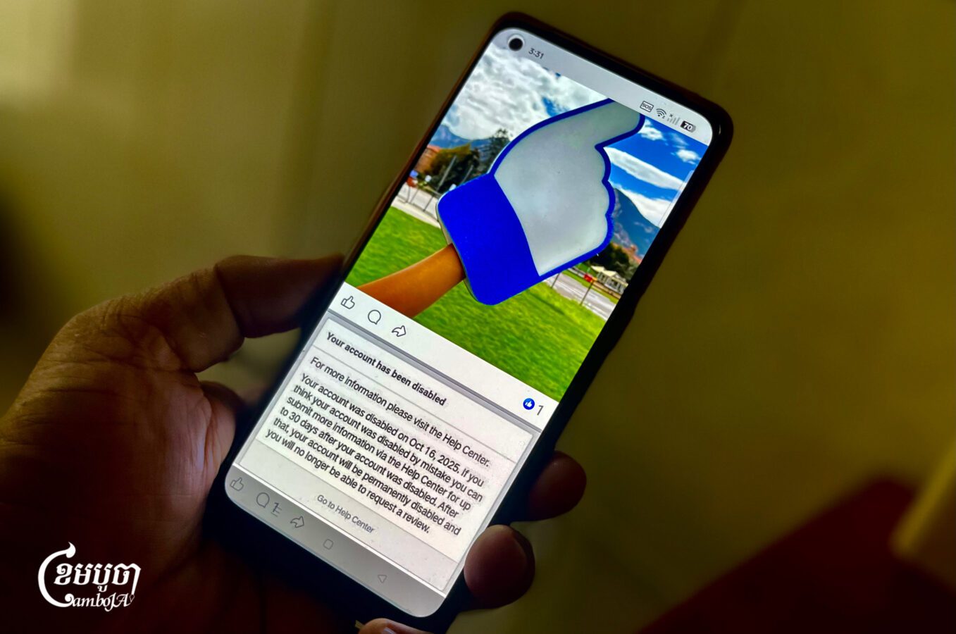 A man checks his disabled Facebook account. Oct. 17, 2025. (CamboJA/Pring Samrang)